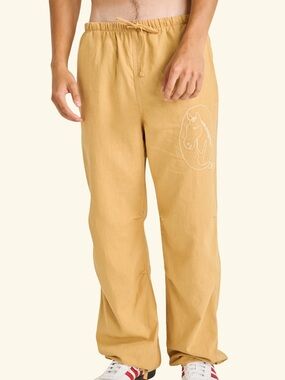 Cherry LA Men's Drawstring Linen Pants in Mustard Yellow with Horse Outline